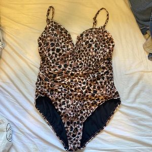 One piece cheetah swimsuit. Only worn once. Full coverage and adjustable straps.